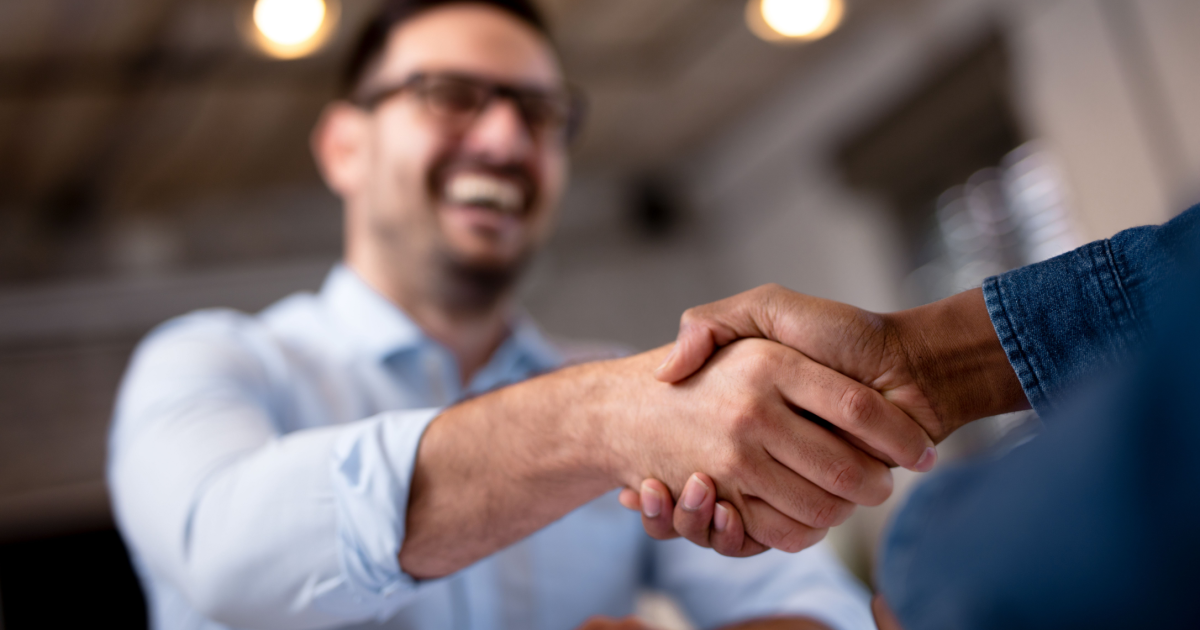 A handshake between an interviewer and potential home care staff member shows that using solid hiring practices pays off.
